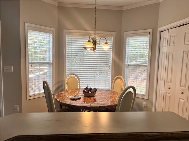 dining space with a notable chandelier and crown molding