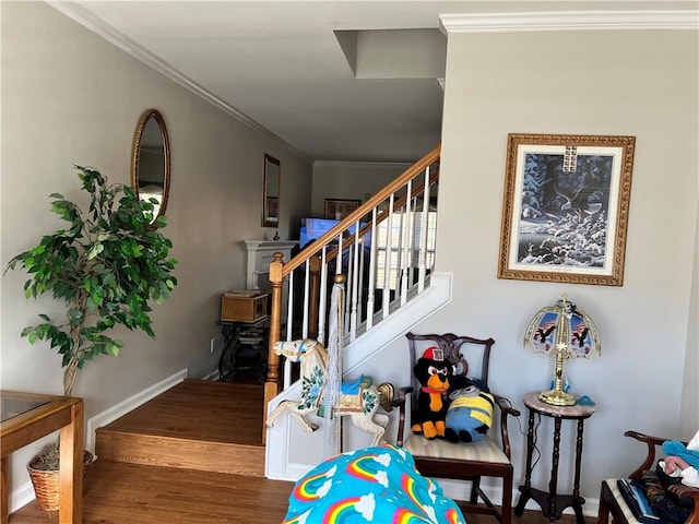 stairway with wood-type flooring and ornamental molding