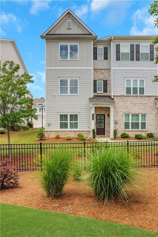 1768 Evenstad Way, Smyrna, GA 30080 - rear view of property featuring fence and board and batten siding