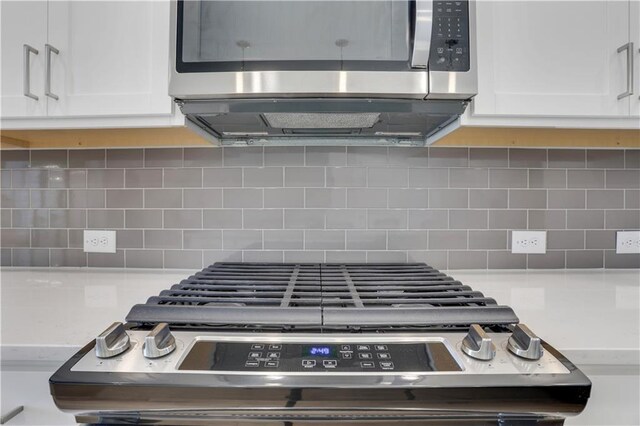 1768 Evenstad Way, Smyrna, GA 30080 - kitchen view of stainless steel microwave, white cabinets, and tasteful backsplash