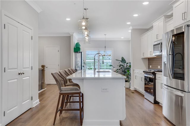1768 Evenstad Way, Smyrna, GA 30080 - kitchen with stainless steel appliances, a sink, decorative backsplash, light countertops, and white cabinetry
