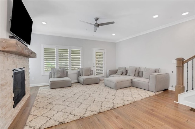 1768 Evenstad Way, Smyrna, GA 30080 - living area featuring ceiling fan, stairs, wood finished floors, a fireplace, and crown molding