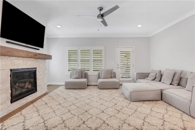 1768 Evenstad Way, Smyrna, GA 30080 - living area featuring ornamental molding, wood finished floors, a fireplace, ceiling fan, and recessed lighting