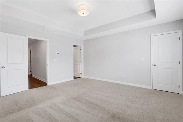 1768 Evenstad Way, Smyrna, GA 30080 - spare room with carpet, a tray ceiling, and baseboards