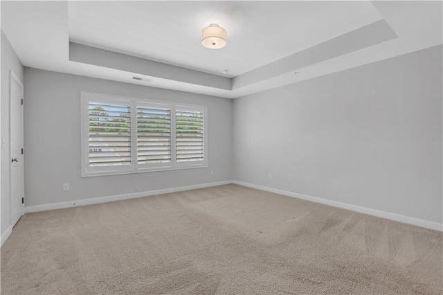1768 Evenstad Way, Smyrna, GA 30080 - spare room featuring a raised ceiling, baseboards, and carpet flooring