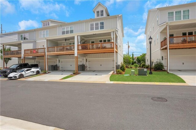 1768 Evenstad Way, Smyrna, GA 30080 - multi unit property featuring board and batten siding, an attached garage, driveway, cooling unit, and ceiling fan