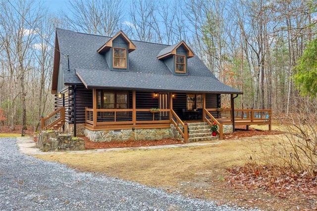 log cabin featuring a porch