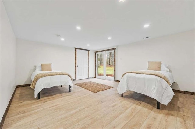 bedroom featuring access to outside and light wood-type flooring