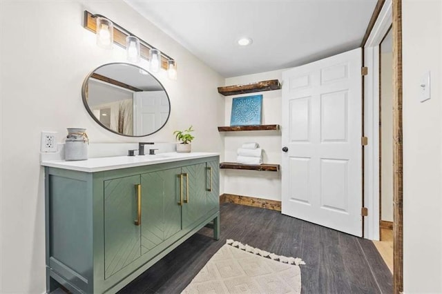 bathroom with vanity and hardwood / wood-style flooring