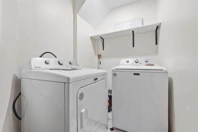 clothes washing area featuring independent washer and dryer