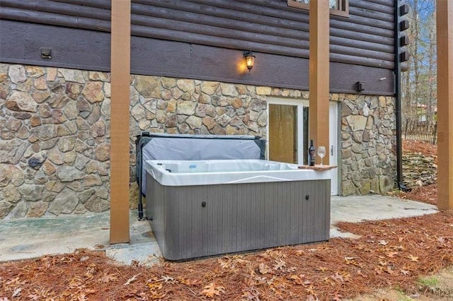 view of patio with a hot tub