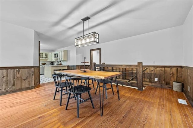 dining area with light hardwood / wood-style flooring