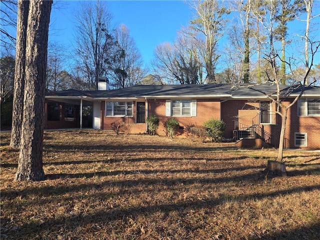 single story home with a carport