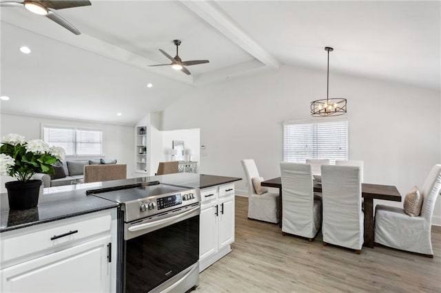 kitchen with stainless steel electric range oven, pendant lighting, lofted ceiling with beams, white cabinetry, and light hardwood / wood-style floors