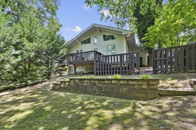 back of property featuring a wooden deck