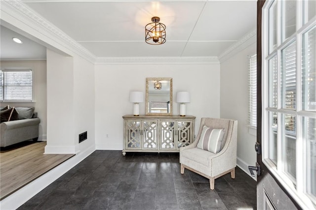 sitting room with ornamental molding