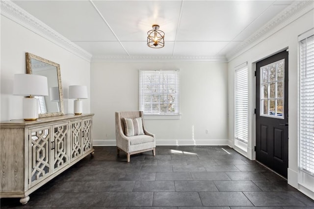 foyer featuring ornamental molding