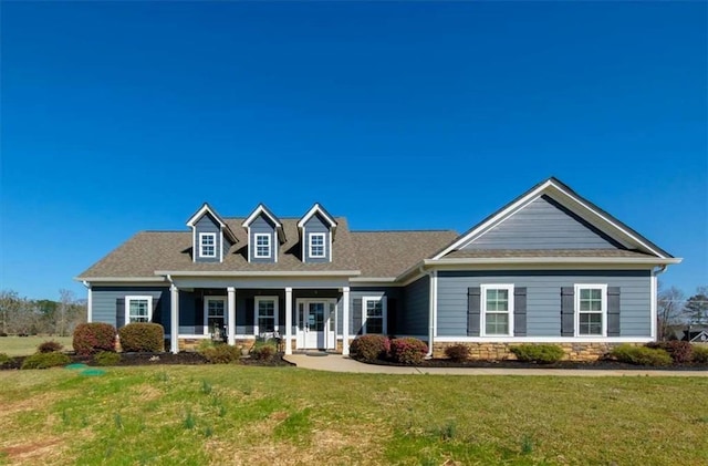 view of front of home with a front yard and a porch