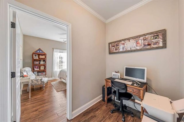 office space featuring baseboards, wood finished floors, and crown molding