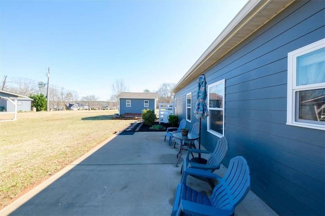 view of patio / terrace with an outbuilding