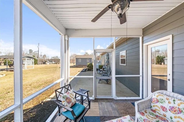 sunroom with a ceiling fan