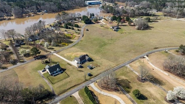 drone / aerial view featuring a water view and a rural view