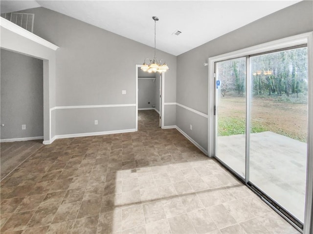 empty room featuring vaulted ceiling, a chandelier, visible vents, and baseboards