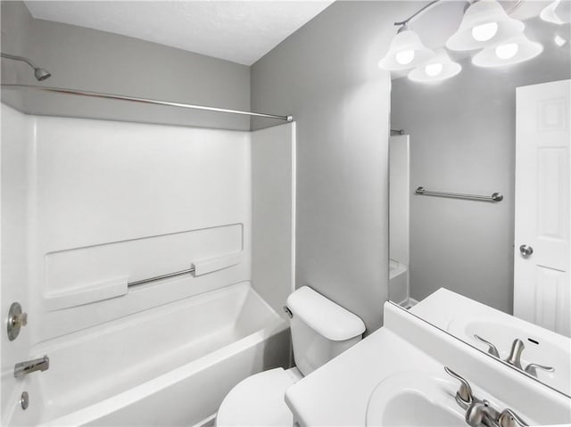 bathroom featuring shower / bathtub combination, vanity, and toilet