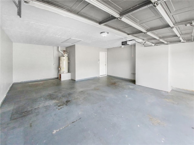 garage featuring gas water heater and a garage door opener