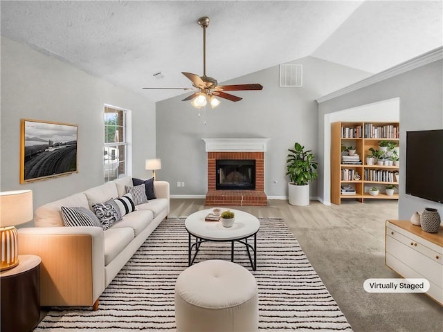 carpeted living room with a fireplace, visible vents, vaulted ceiling, ceiling fan, and baseboards