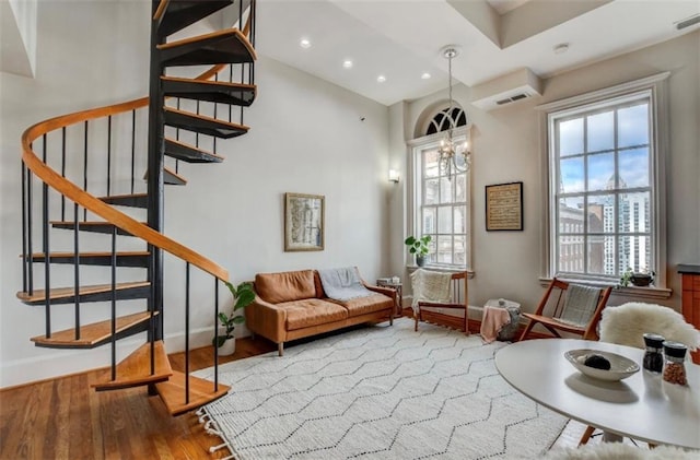 30 5th St NE Unit 1006, Atlanta, GA 30308 - living area featuring wood finished floors, stairway, baseboards, and recessed lighting