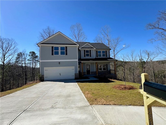 view of front of house with an attached garage, a porch, concrete driveway, and a front yard