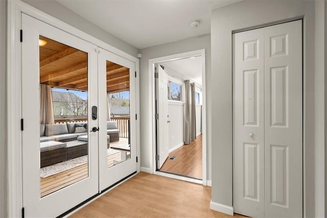 entryway featuring light hardwood / wood-style floors and french doors