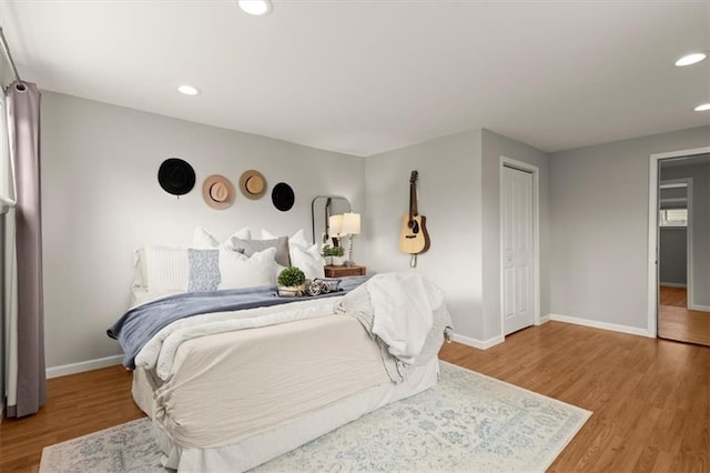 bedroom featuring hardwood / wood-style flooring and a closet