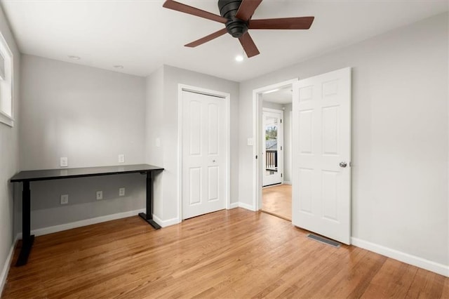 spare room with light hardwood / wood-style floors and ceiling fan