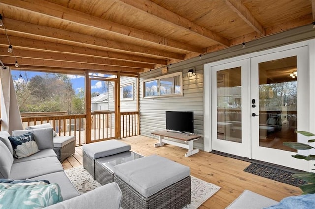 sunroom / solarium with wooden ceiling, french doors, and beamed ceiling