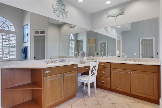 full bathroom with tile patterned floors and vanity