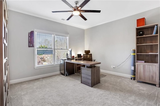 office area with baseboards, light carpet, ceiling fan, and ornamental molding