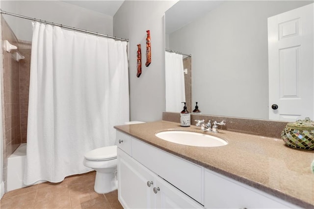 full bath with tile patterned flooring, toilet, vanity, and shower / tub combo