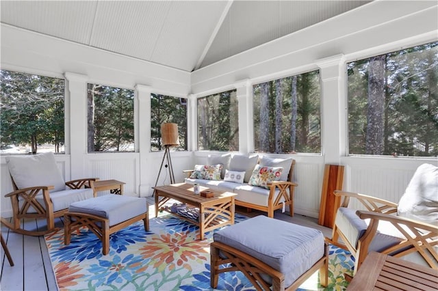 sunroom / solarium featuring vaulted ceiling