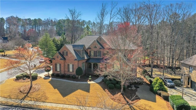 view of front facade featuring a front lawn and brick siding