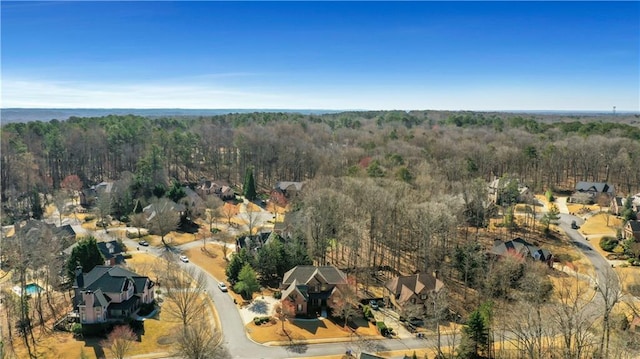 bird's eye view featuring a forest view