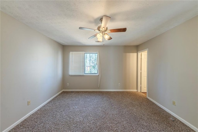 spare room featuring ceiling fan, a textured ceiling, and carpet