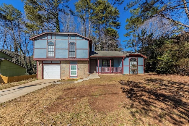 view of front of house with a porch and a garage