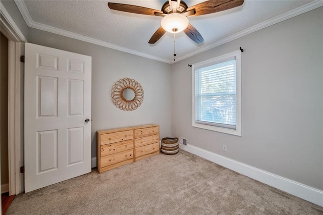 carpeted bedroom featuring crown molding, ceiling fan, and a textured ceiling