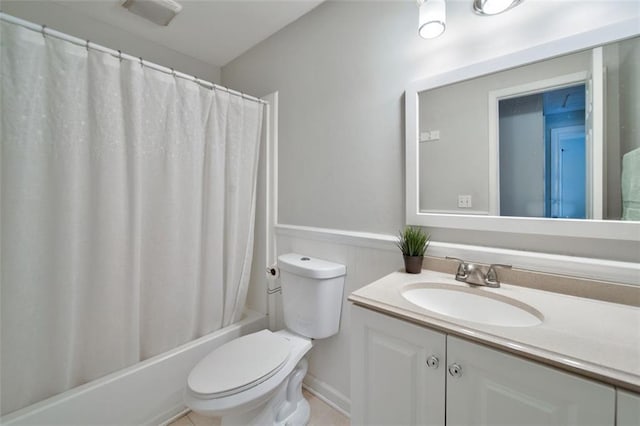 full bathroom with vanity, toilet, and shower / tub combo with curtain