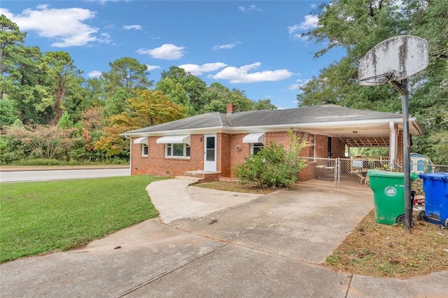 ranch-style house with a carport and a front yard