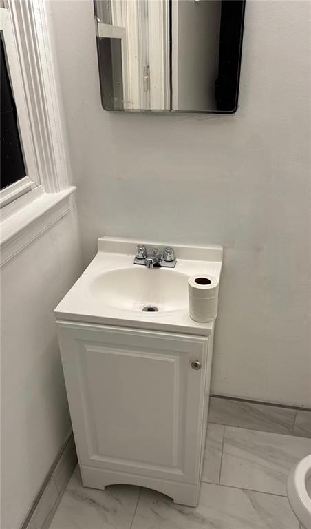 bathroom with vanity and toilet