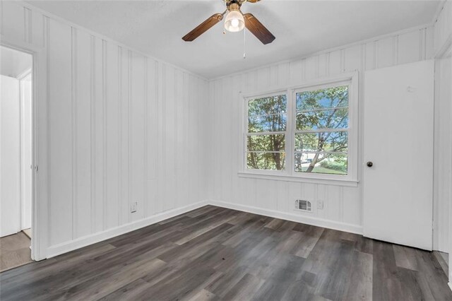 unfurnished room featuring ceiling fan and dark hardwood / wood-style floors