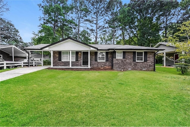 view of front of property with a carport and a front yard